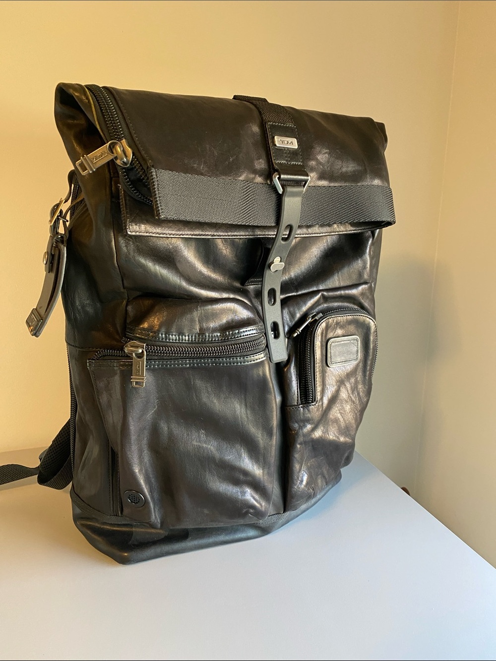 Tumi Black Leather Roll-Top Backpack with Front Pockets
